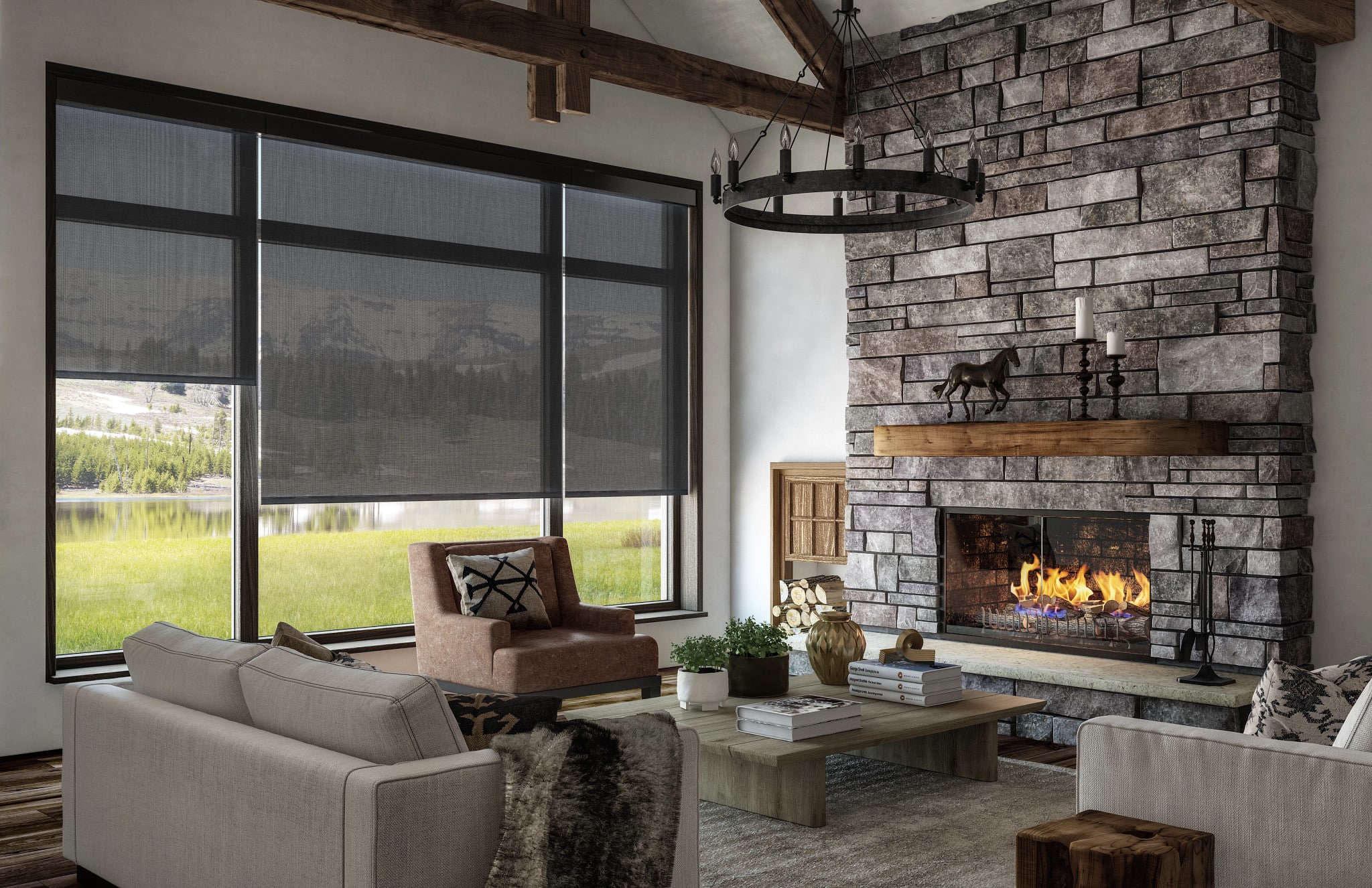 Living room with large windows covered by dark solar shades, looking out to a grassy field and mountain view.
